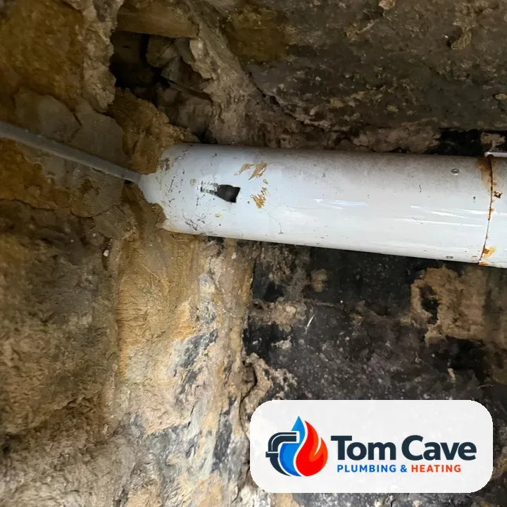 Before: old boiler flue with a hole rusted through the outer pipe